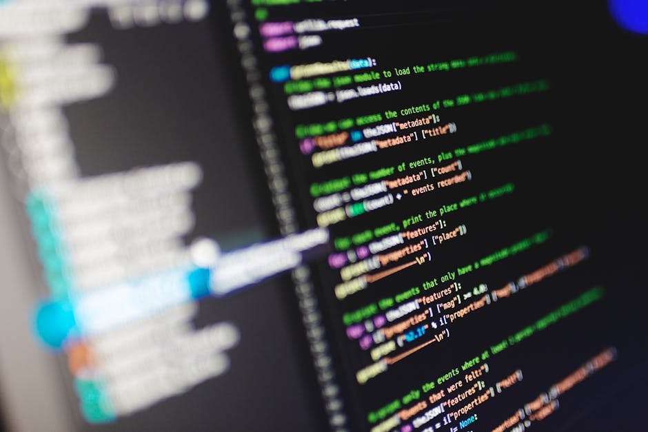 Close-up of a computer screen displaying colorful programming code in JavaScript.