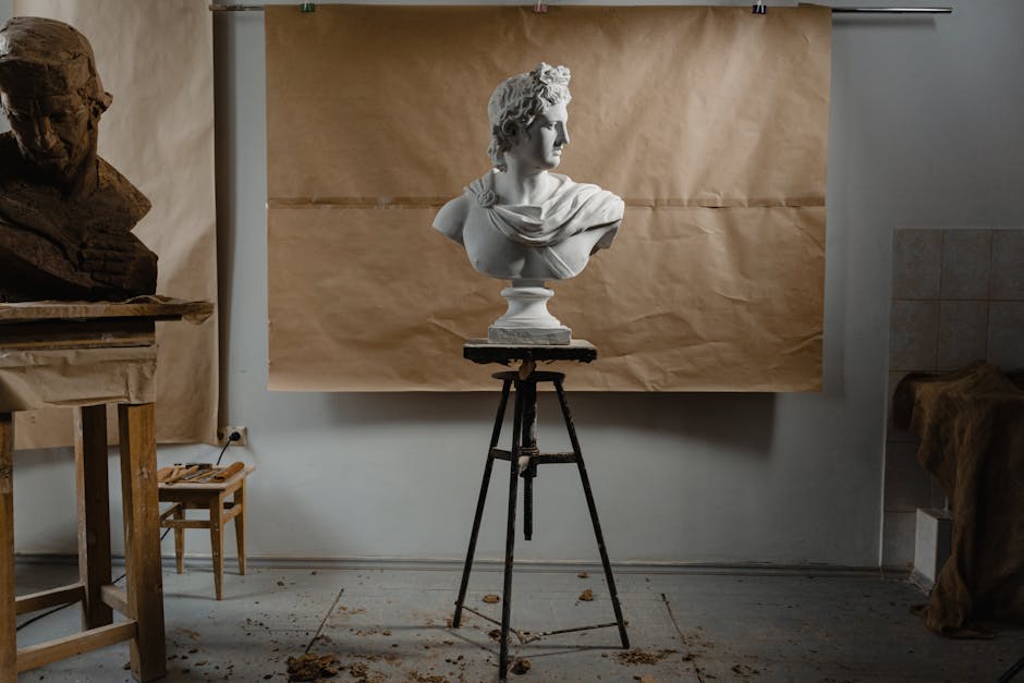 Elegant classical bust sculpture displayed in an artistic studio setting.