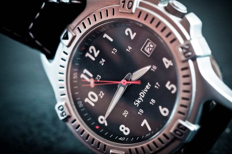 Close-up shot of a sleek diver's wristwatch with labeled time and date display, ideal for adventure seekers.